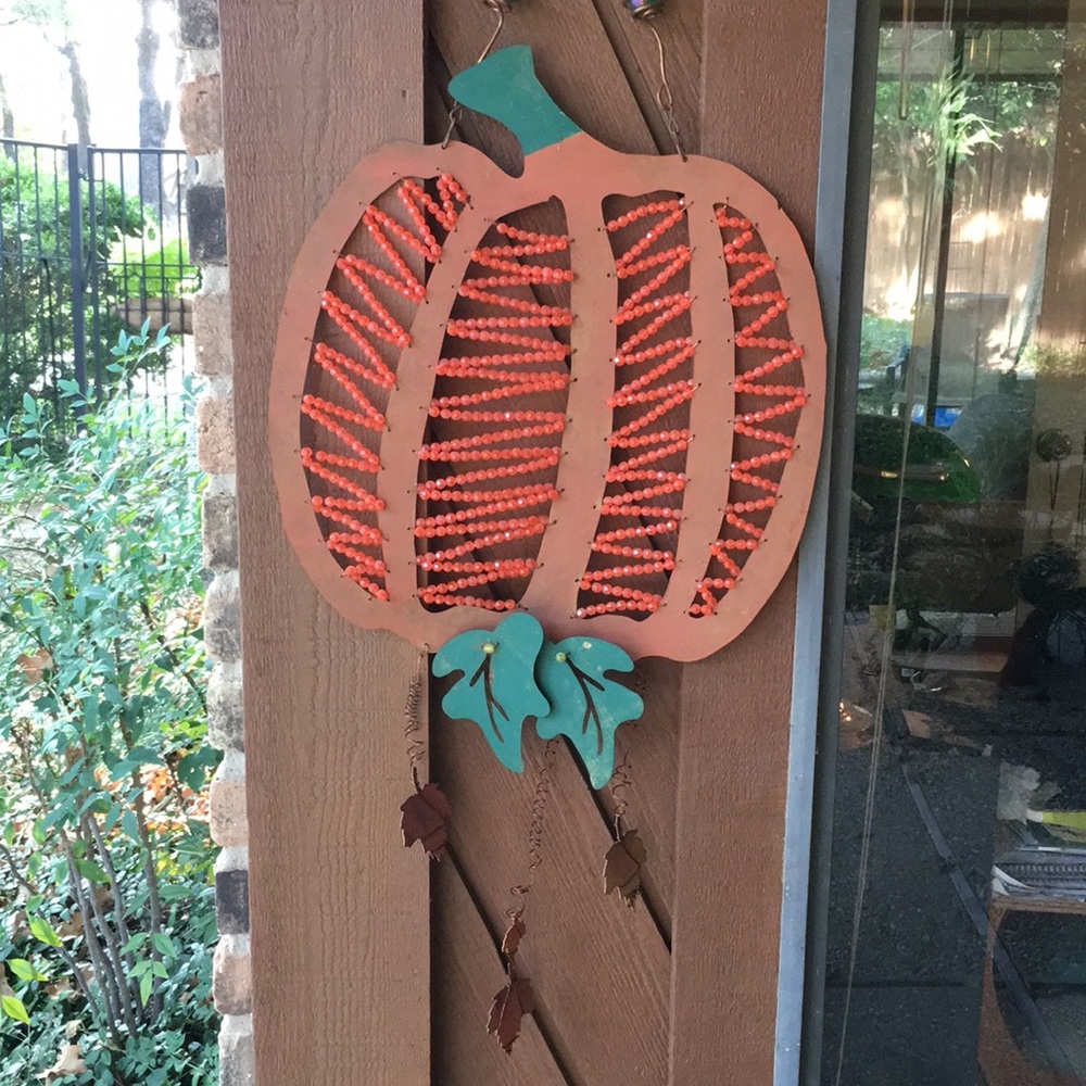 Fall decoration! Orange & green metal pumpkin. Approx. 16”x 16” $15